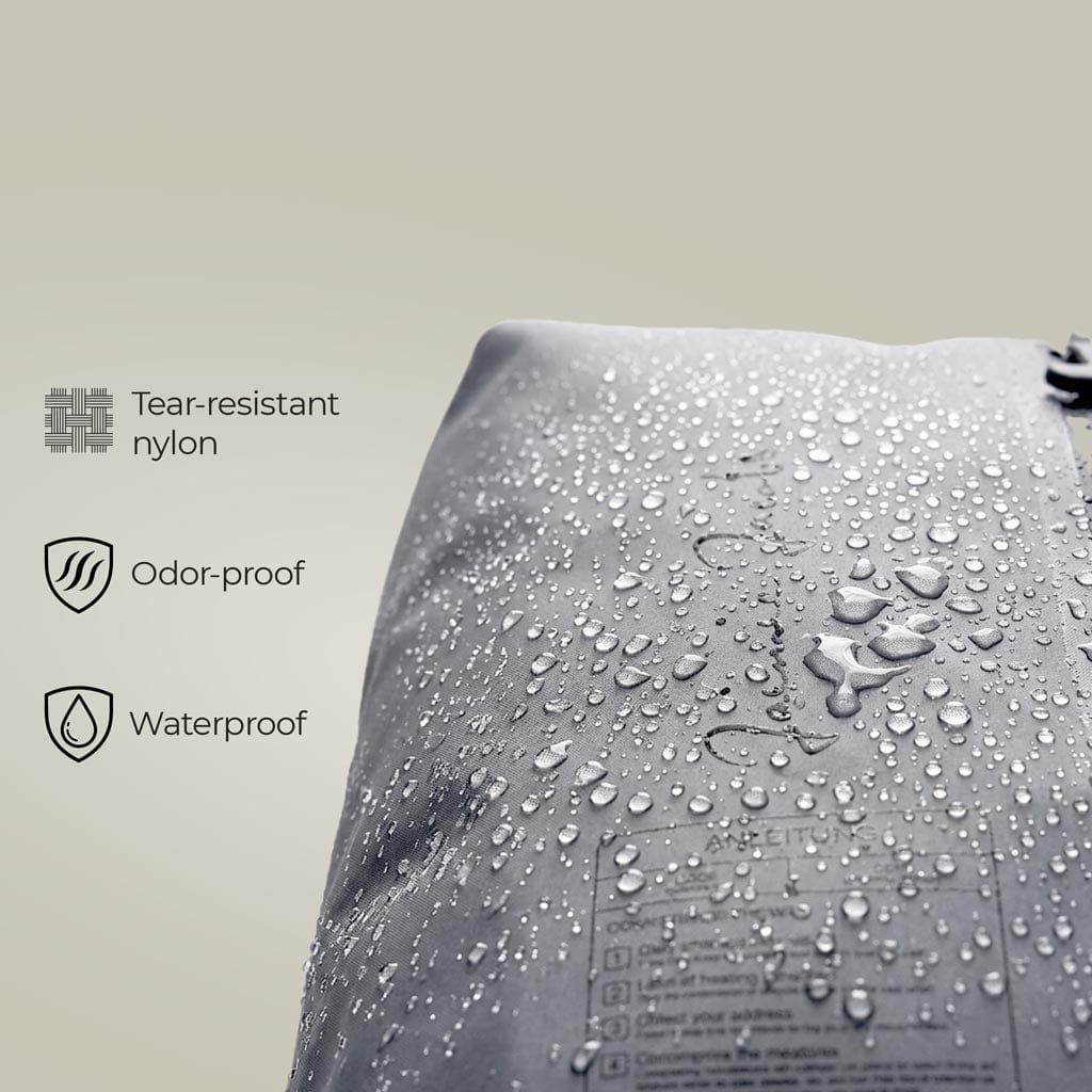 close up of the jaimie jacobs compression bag shows the waterproof material with waterdrops